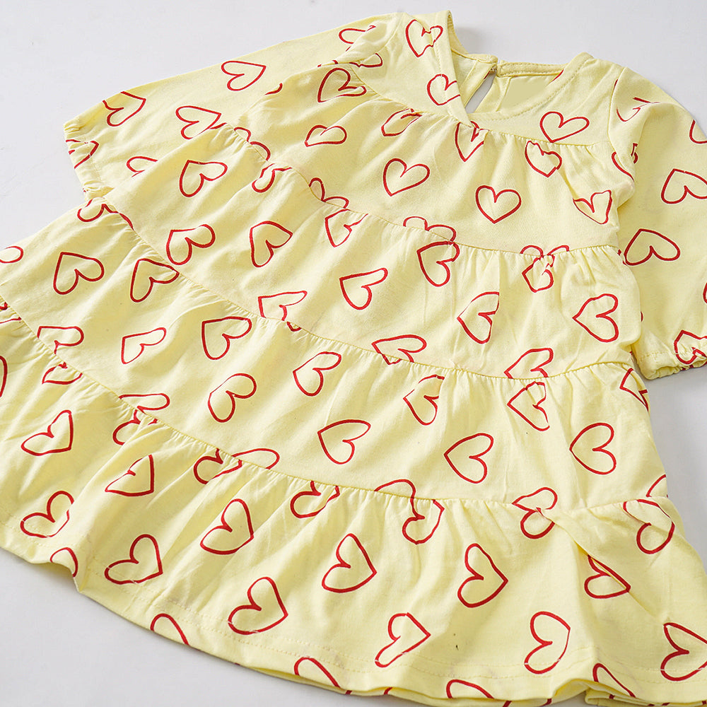Heartfelt Layers: Light Yellow Dress with Red Heart Print and Tiered Design