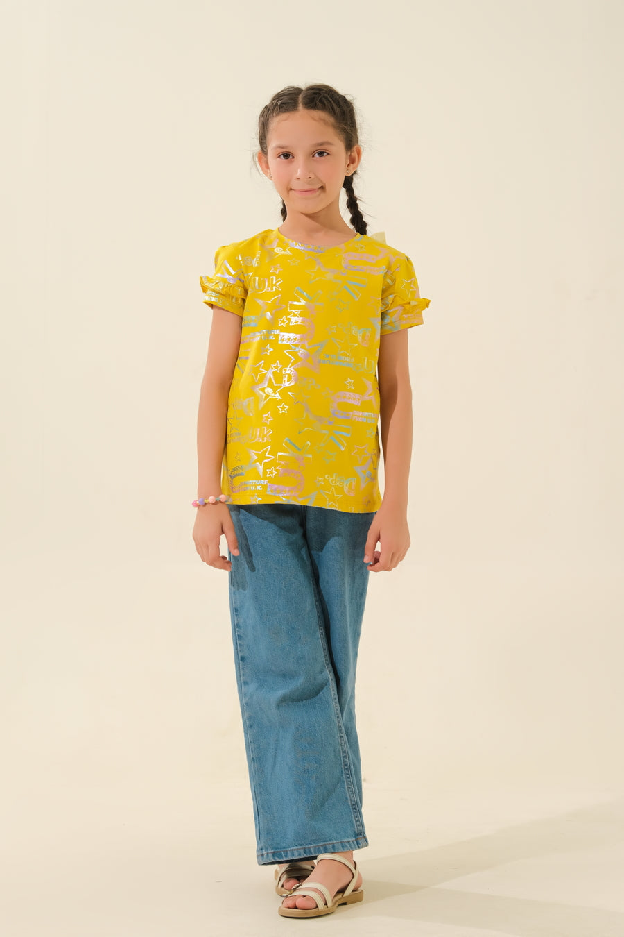 Bright & Playful: Young Girl in Yellow Print Top