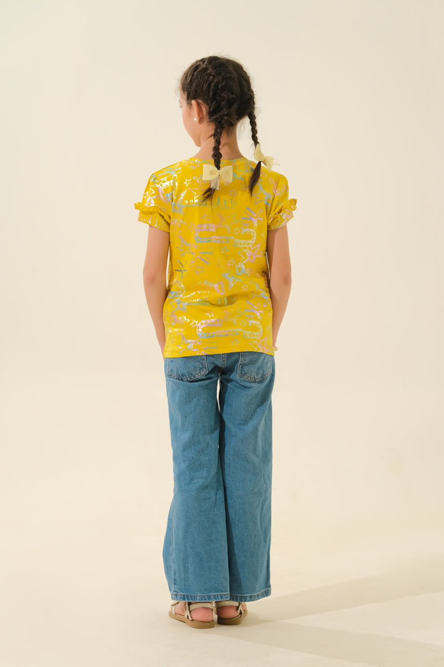 Bright & Playful: Young Girl in Yellow Print Top