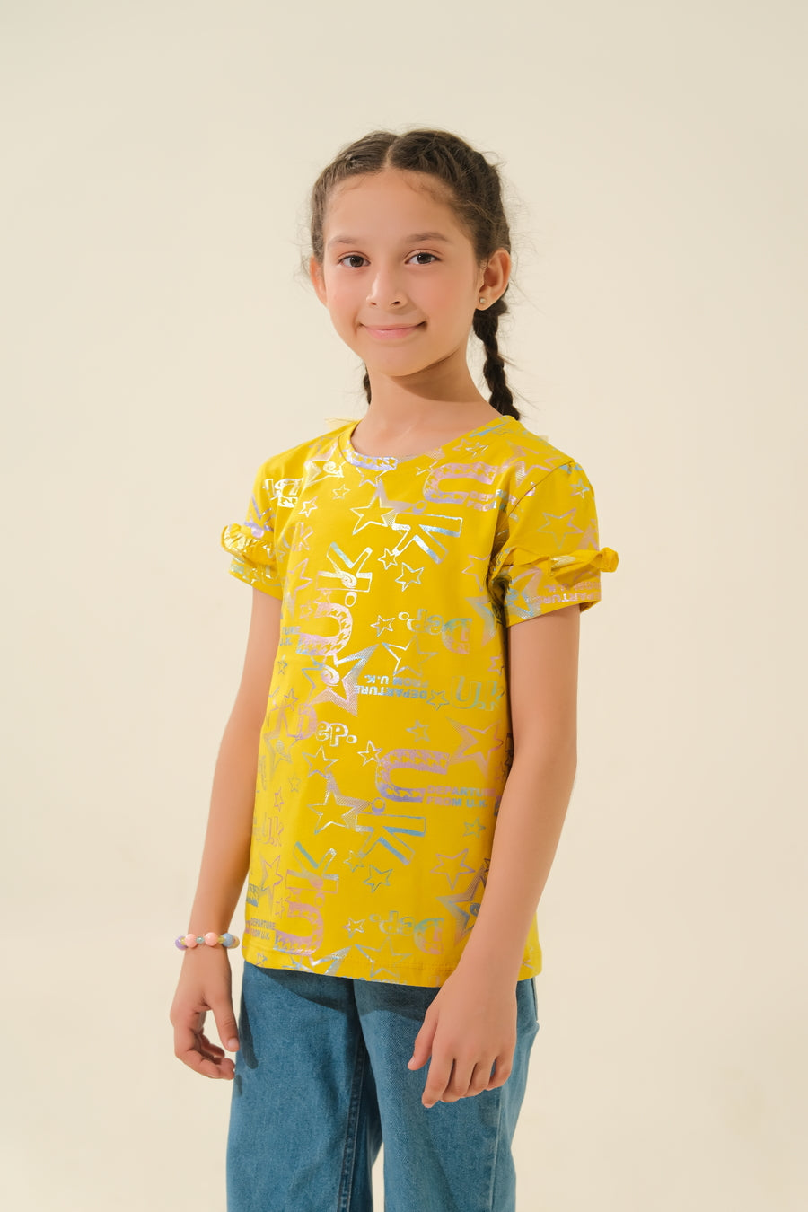 Bright & Playful: Young Girl in Yellow Print Top